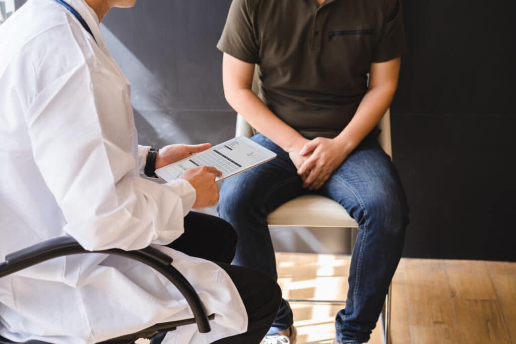 A man talking to a doctor about erectile dysfunction treatment