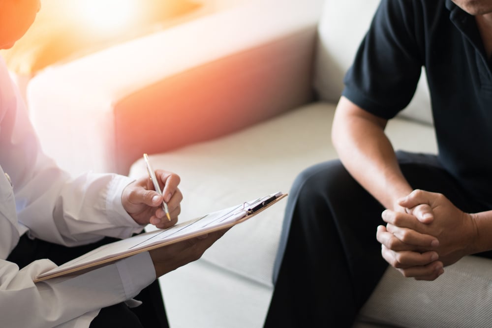 Man discussing his health concerns with his doctor at Men’s Health Clinic in LA.